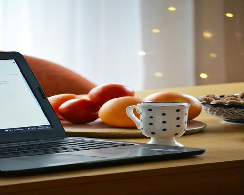 Cozy workspace with a laptop and a cup of coffee